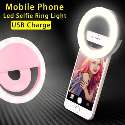 Round, pink LED ring light that clips onto a smartphone to provide illumination for selfies and videos. USB