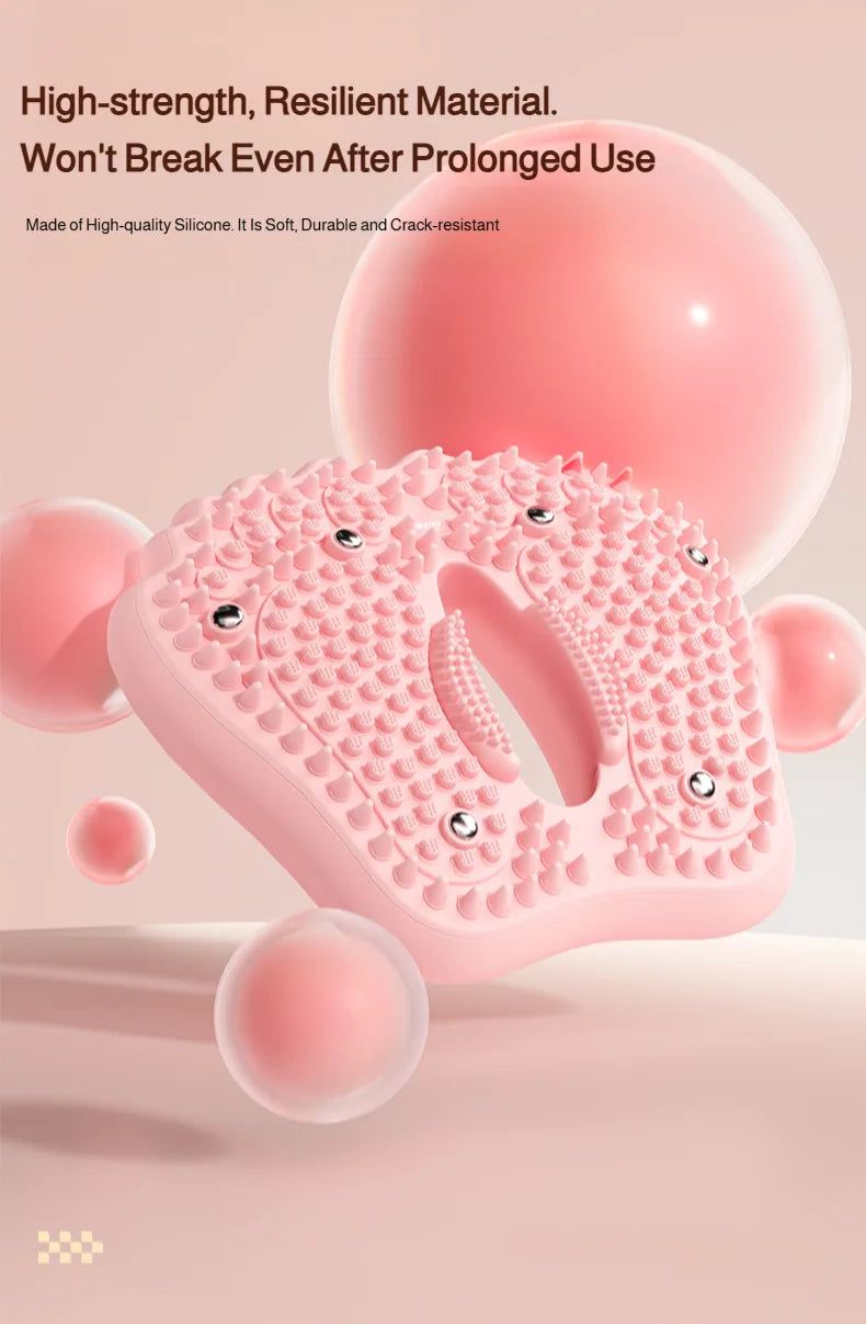 Pink silicone foot massage mat with textured acupoint nubs and embedded magnetic stones, floating on a light background.