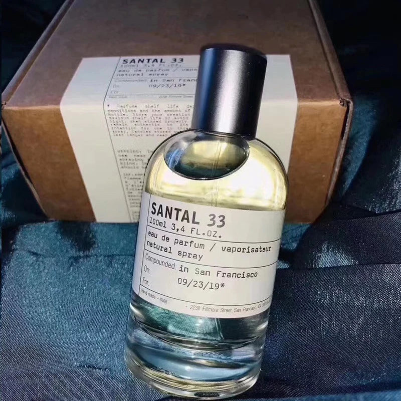 SANTAL 33 unisex Eau de Parfum 100ml spray in clear glass bottle with minimalist white label and black cap.