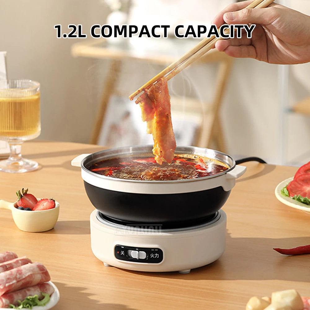 Portable electric cooking pot with black bowl heating stew on white base, compact size