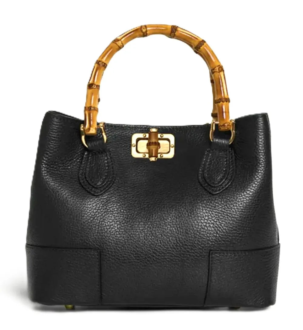 Royaa black pebbled leather tote with bamboo handle and gold-tone turn-lock closure. Designer fashion top handle purse.