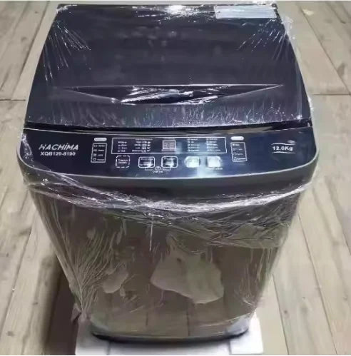 Tidesmit 12kg top load washing machine, side view showing control panel and stainless steel laundry drum interior