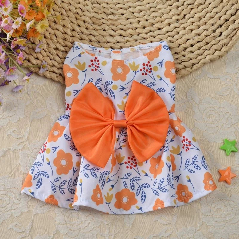 Cute orange floral dog princess dress with a large bow for small dogs and puppies, perfect for spring and summer style.