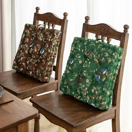 Square brown and green fabric meditation pillows with bird patterns for mindful seating and comfort.