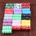 Leak-proof colorful dog poop bags with paw prints for easy, mess-free pet waste cleanup.
