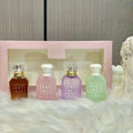 KAYALI 4x30ml unisex perfume gift set: sweet vanilla, marshmallow, and pistachio scents in iconic glass travel bottles.