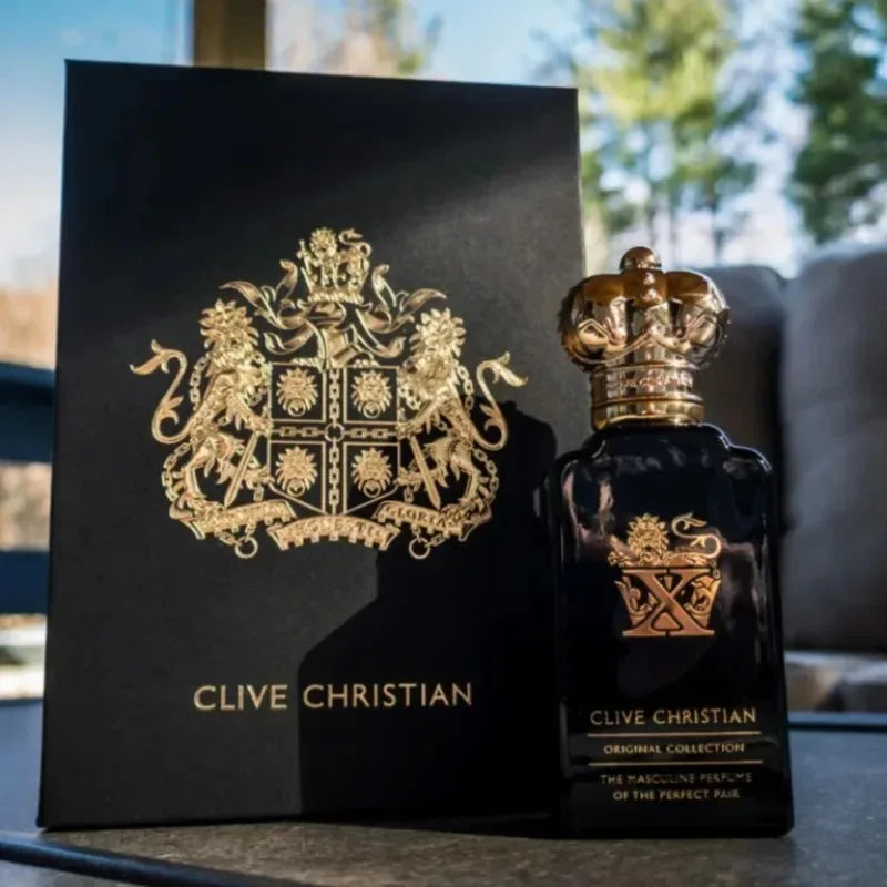Clive Christian X masculine perfume in a rectangular black glass bottle with a gold crown cap and matching gift box.