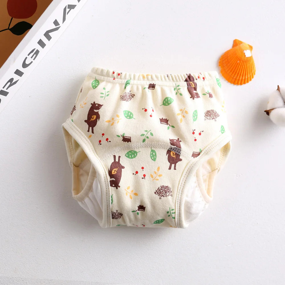 Training diaper for toddlers, cream cotton with cute bear and hedgehog woodland print. Baby care potty training pants.