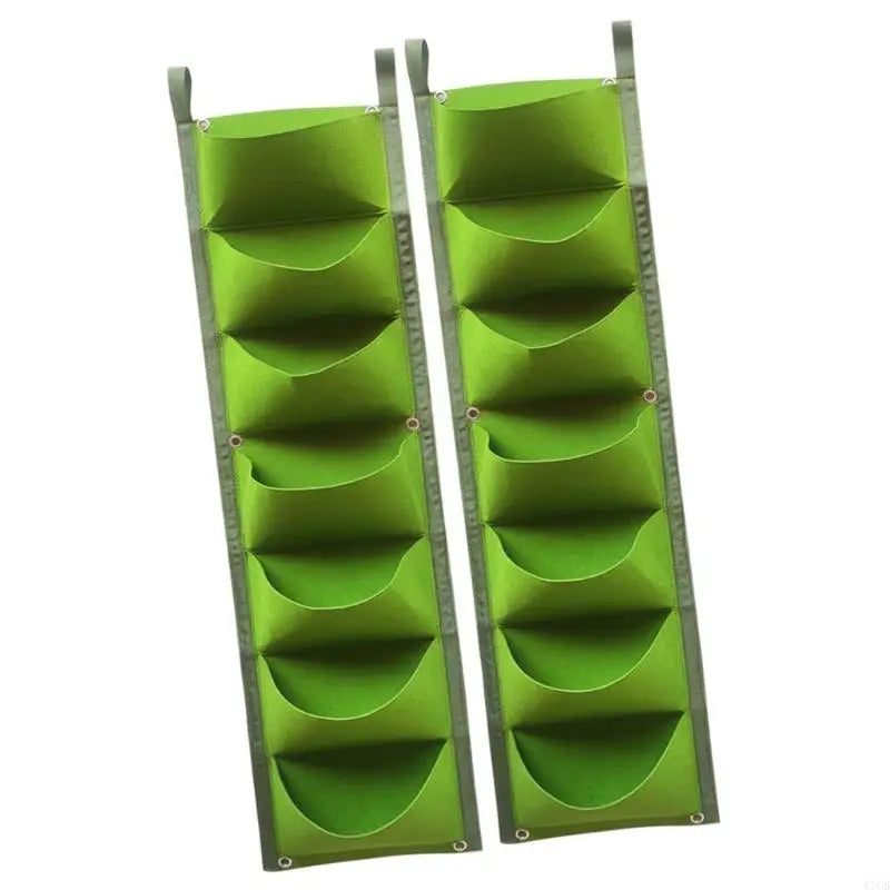 Pair of green vertical grow bags with seven fabric pockets and hanging straps