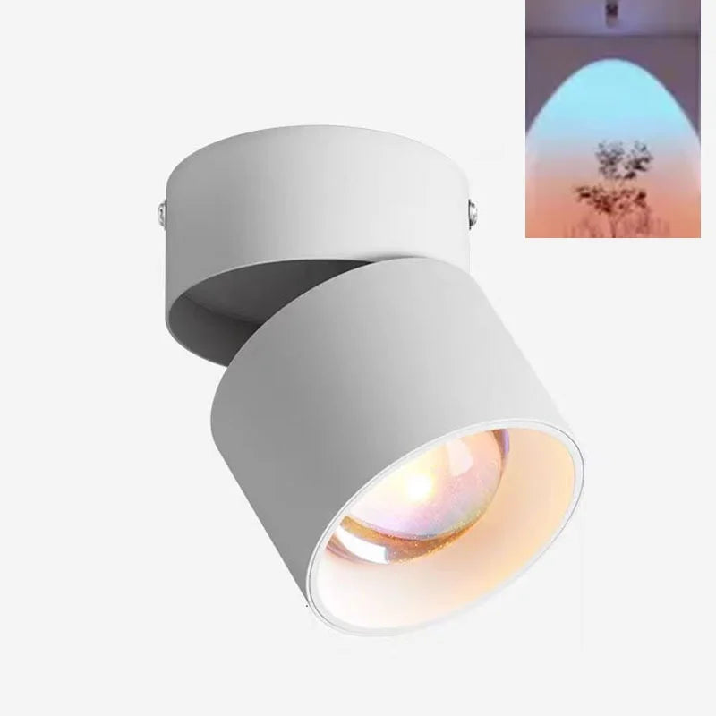 White LED ceiling surface spotlight with angled cylindrical head and bright warm lens