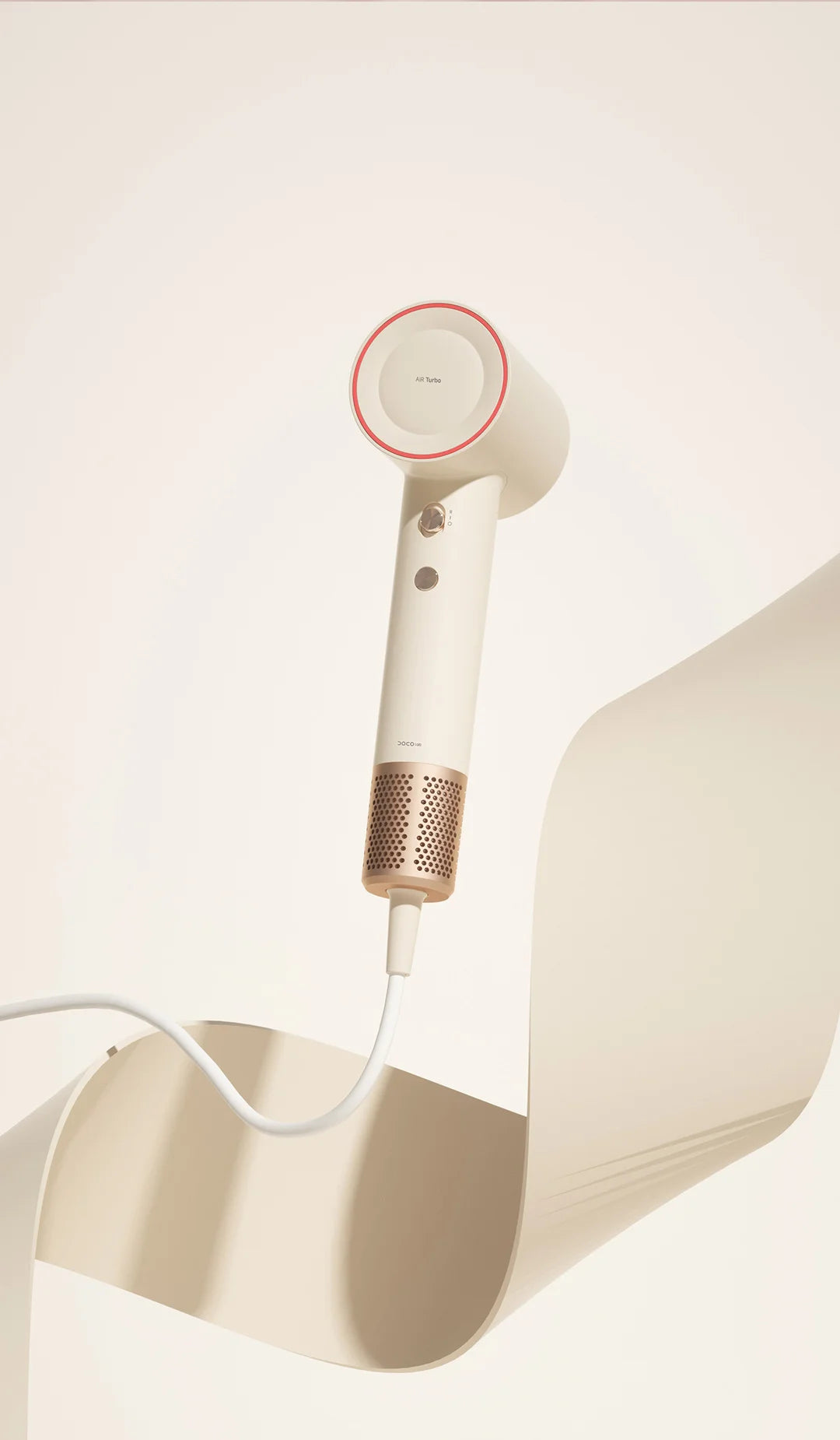 DOCO high-speed hair dryer in beige with rose gold accents, featuring advanced ionic technology and sleek design.