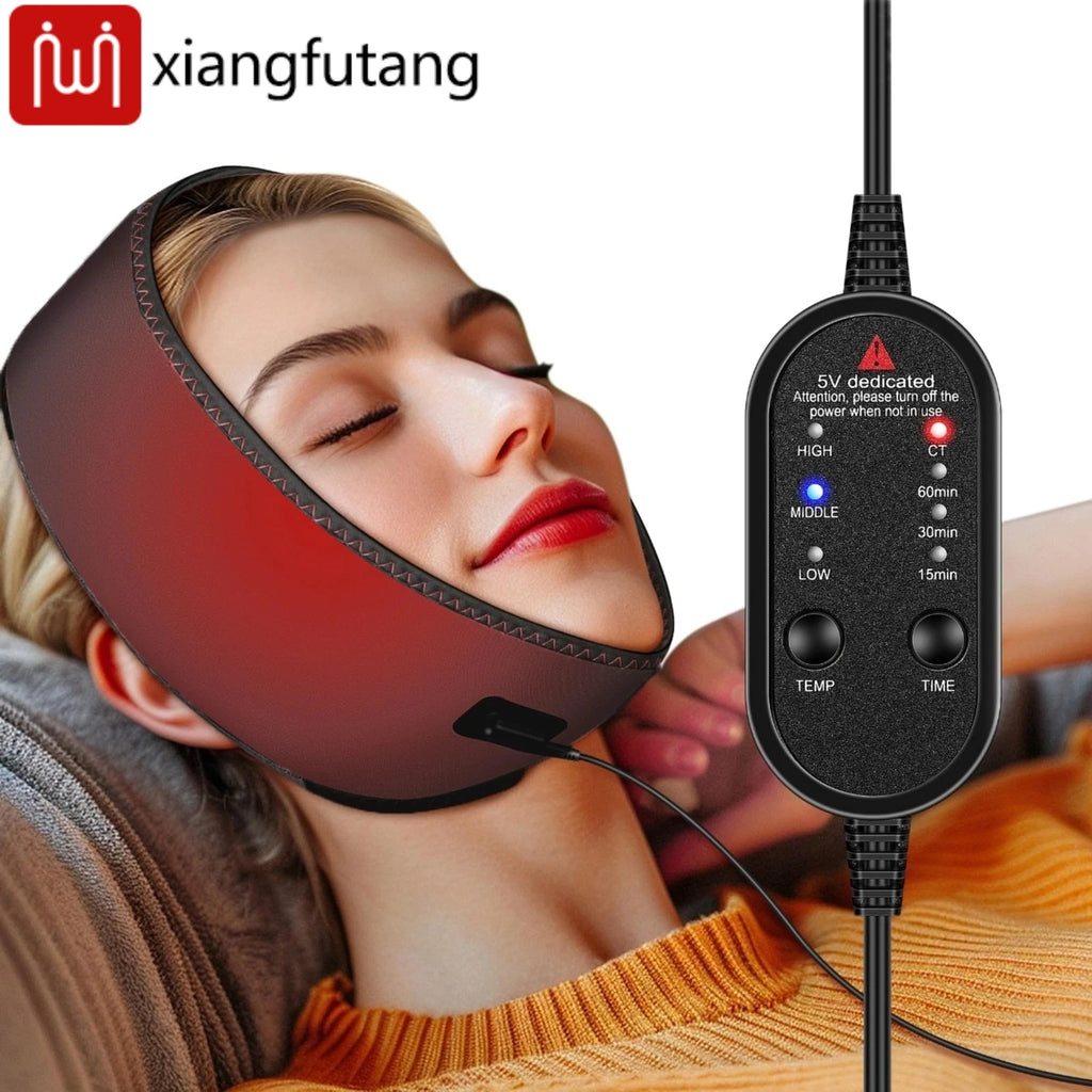 A woman wearing a maroon, wrap-around electric jaw heating pad with an attached black digital temperature controller.
