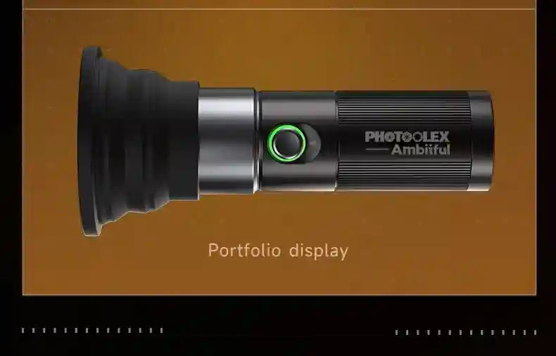 Black handheld LED video light with a flared silicone diffuser, metal body, and illuminated green power button.