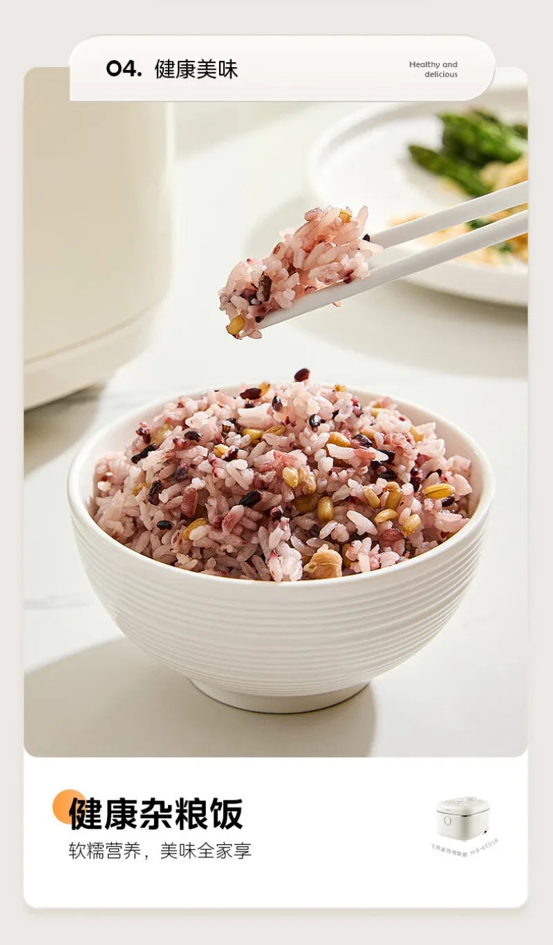 White Midea rice cooker with bowl of cooked rice and serving chopsticks