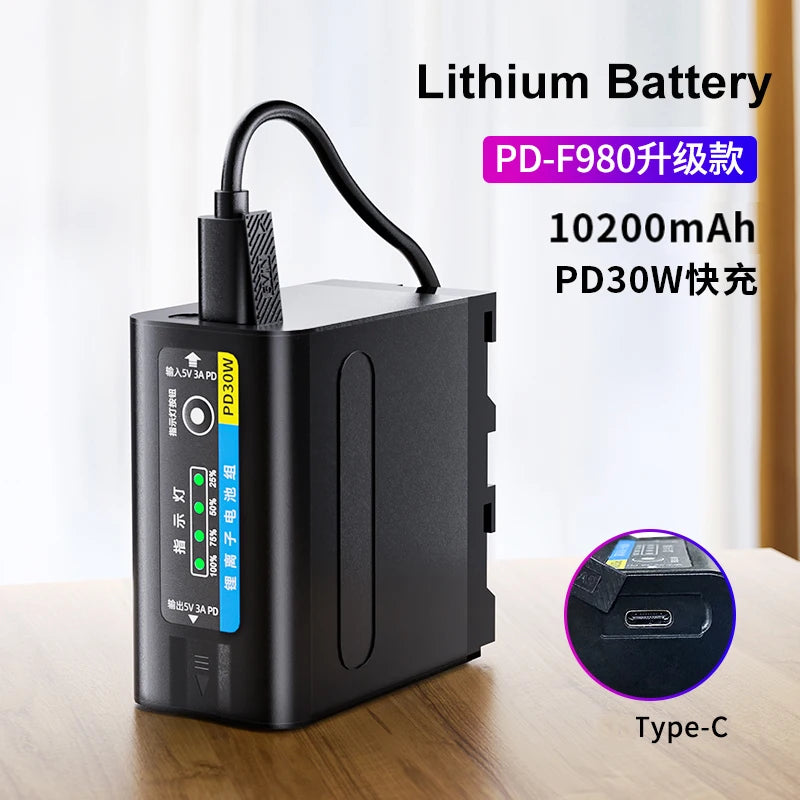 Black rectangular 10200mAh lithium battery for cameras with a USB-C charging port and LED capacity indicator lights.