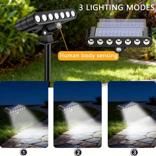 Black solar LED spotlight on a ground stake, with solar panel, motion sensor, and 3 lighting modes.
