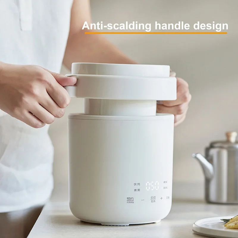 Smart white electric cooker pot with anti-scalding carry handle and stacked lid.