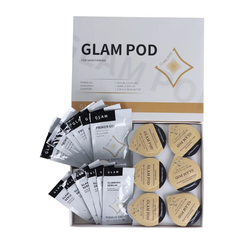 Glam Pod skin firming set with white serum packets and round beige exfoliating pods in a branded display box.