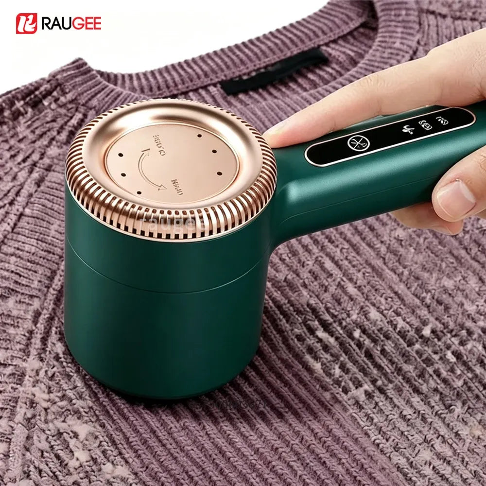 RAUGEE fabric shaver removes fuzz from a purple knit sweater, featuring a green and rose gold design.