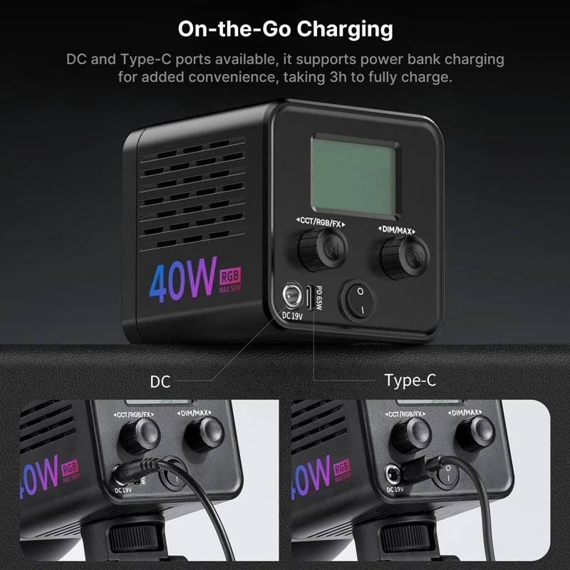 Compact black cube-shaped LED video light with LCD screen, control knobs, and DC/USB-C charging ports for mobile power.
