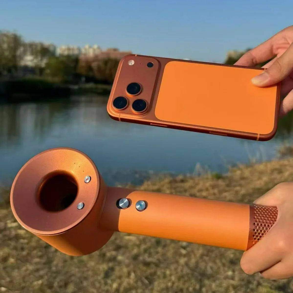 Orange high-speed brushless hair dryer with metallic buttons and fast-drying negative ion technology for hair care.