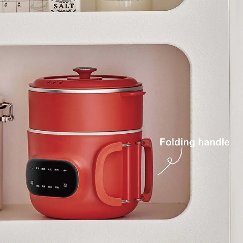Red electric cooking pot inside built-in cabinet; folding handle and control panel visible