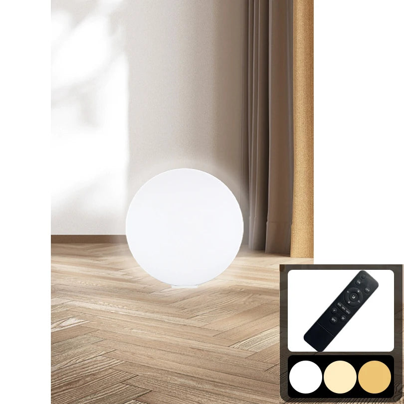White round LED floor lamp with remote control for adjustable color temperature and brightness settings.