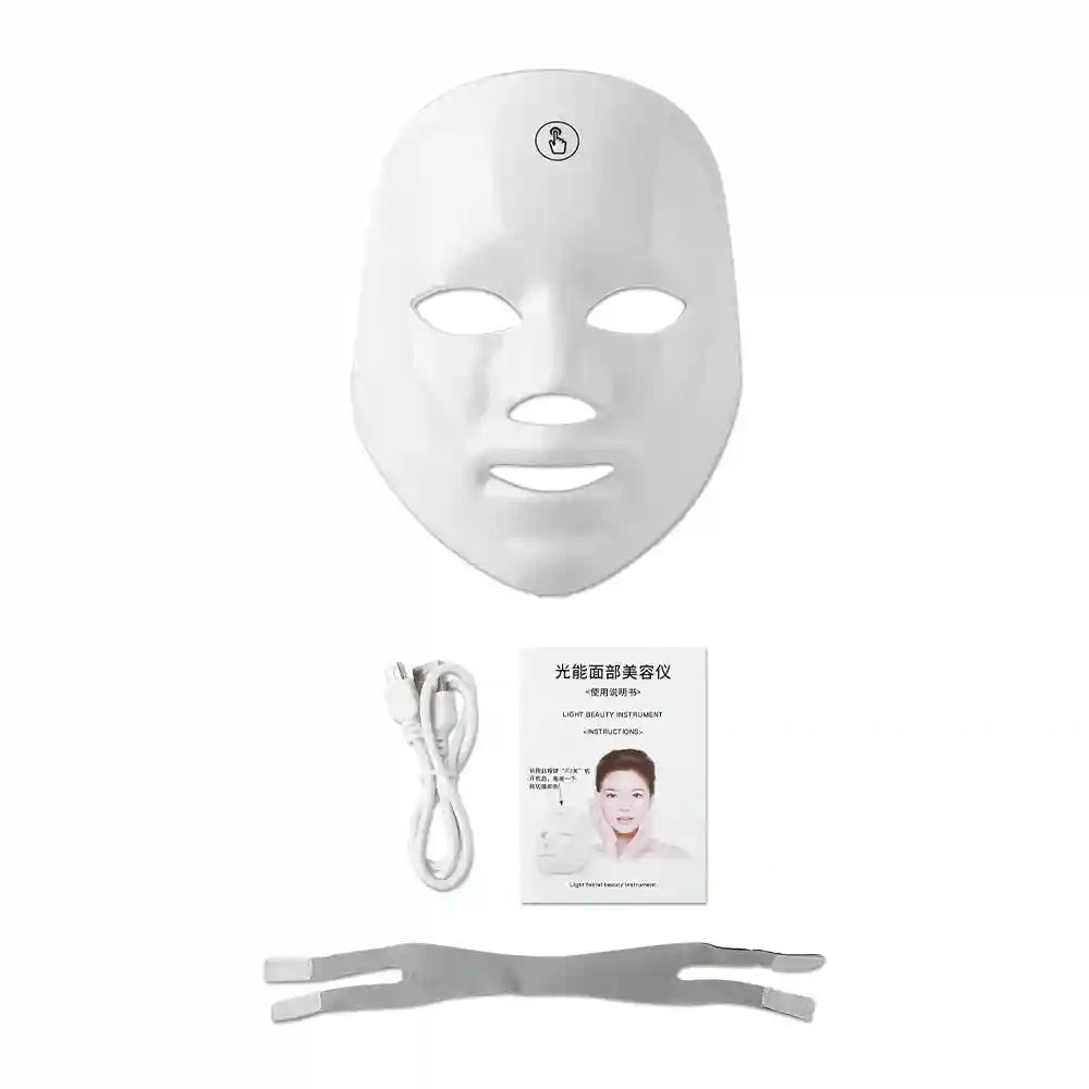White rechargeable LED facial mask set including a charging cable, instruction manual, and an adjustable strap.