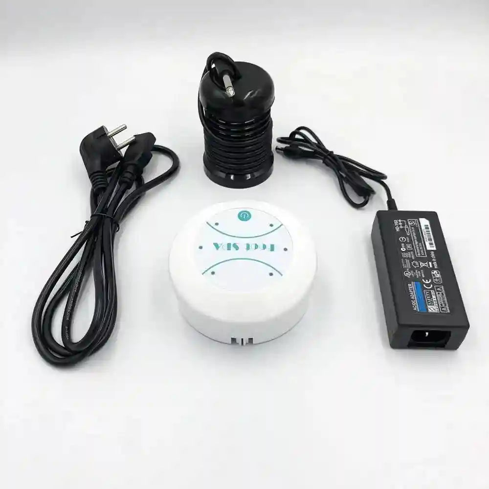 Ionic foot spa detox machine with a white circular controller, black cylindrical array, power cord, and AC adapter.