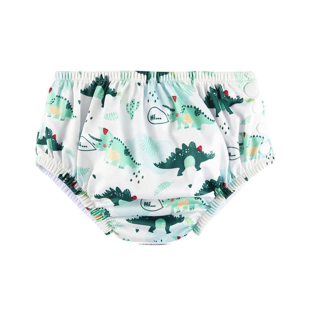 Reusable baby swim diaper with green dinosaur print and side snap buttons for adjustable fit.