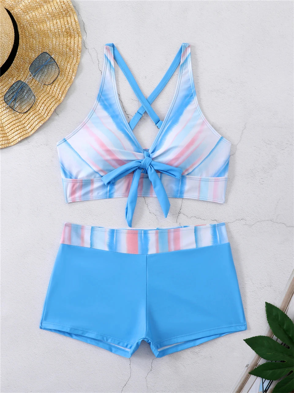Tidesmit high-waisted blue bikini with a striped, tie-front padded sports top and solid blue boy-short bottoms.