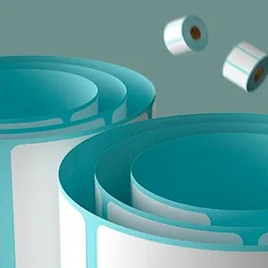Curled roll of white thermal labels with light-blue backing and exposed inner core