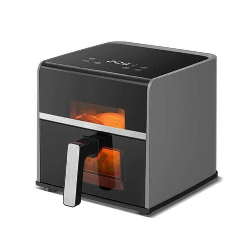 Black air fryer oven with viewing window and front handle, heating glow inside