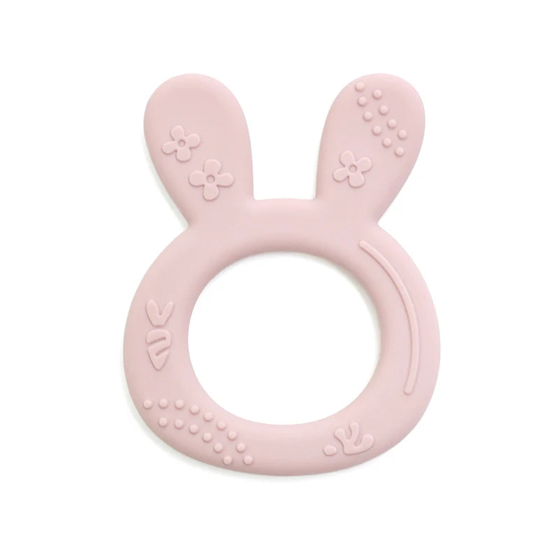 Light pink silicone teething ring for baby teething relief, featuring a cute bunny design.