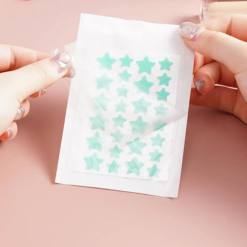 Star-shaped acne patch stickers (28 pcs), mint blue stars on a backing sheet.