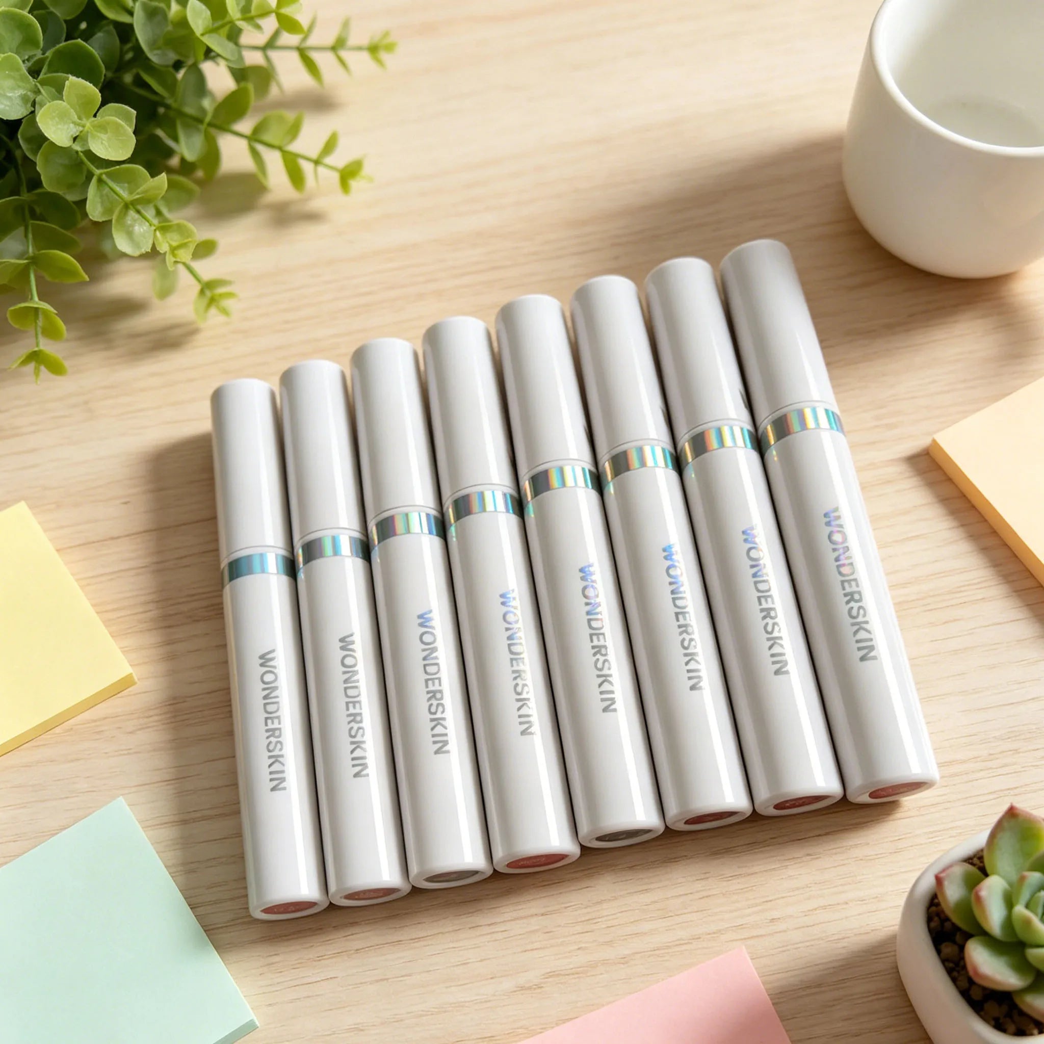 Wonderskin peel-off lip tint tubes in a sleek white matte finish, perfect for long-lasting waterproof lip color.