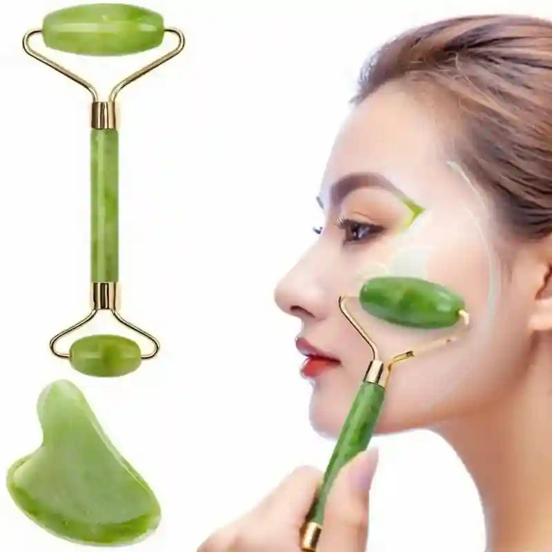 A green jade face roller and heart-shaped gua sha tool shown with a woman using the roller on her cheek.