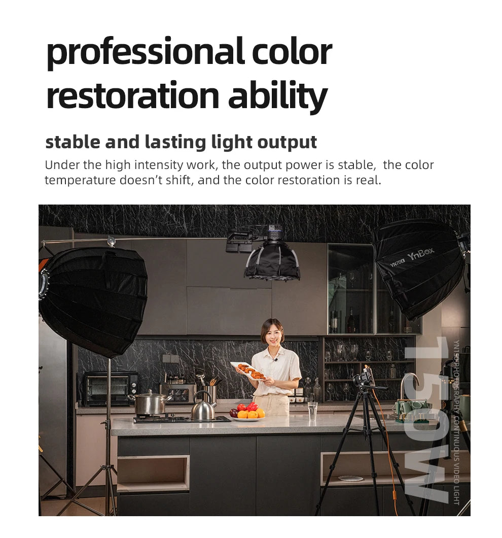 150W continuous video light with black softbox dome, mounted on stands to illuminate a kitchen cooking scene.
