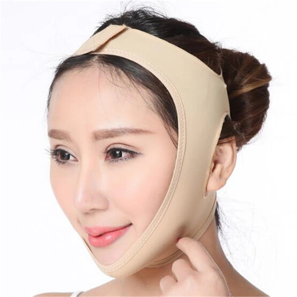 A person wears a nude-colored elastic face-slimming bandage that wraps around the chin and secures over the head.