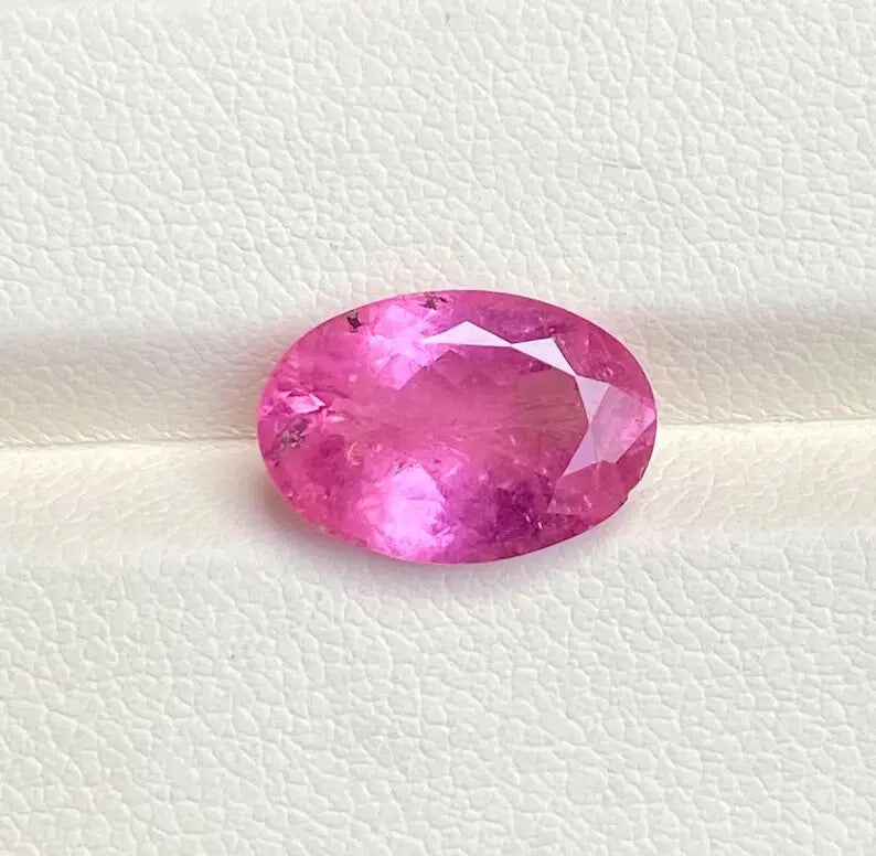 Oval-cut natural pink sapphire gemstone, faceted oval loose stone