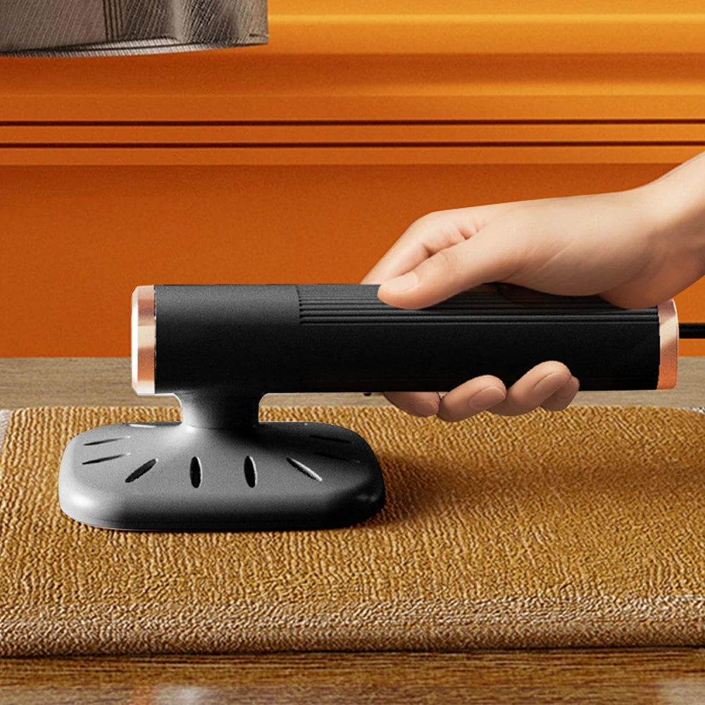 Tidesmit 360-degree rotating handheld mini steam iron showing ergonomic design for portable garment steaming