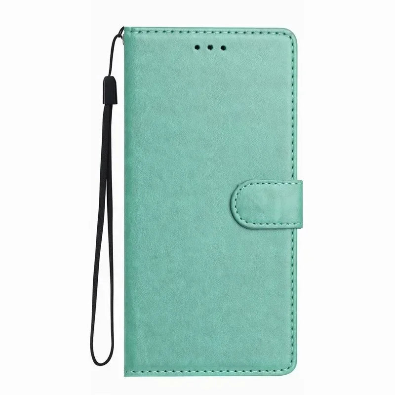 Mint green faux leather wallet phone case with a magnetic strap and a detachable black wrist lanyard.