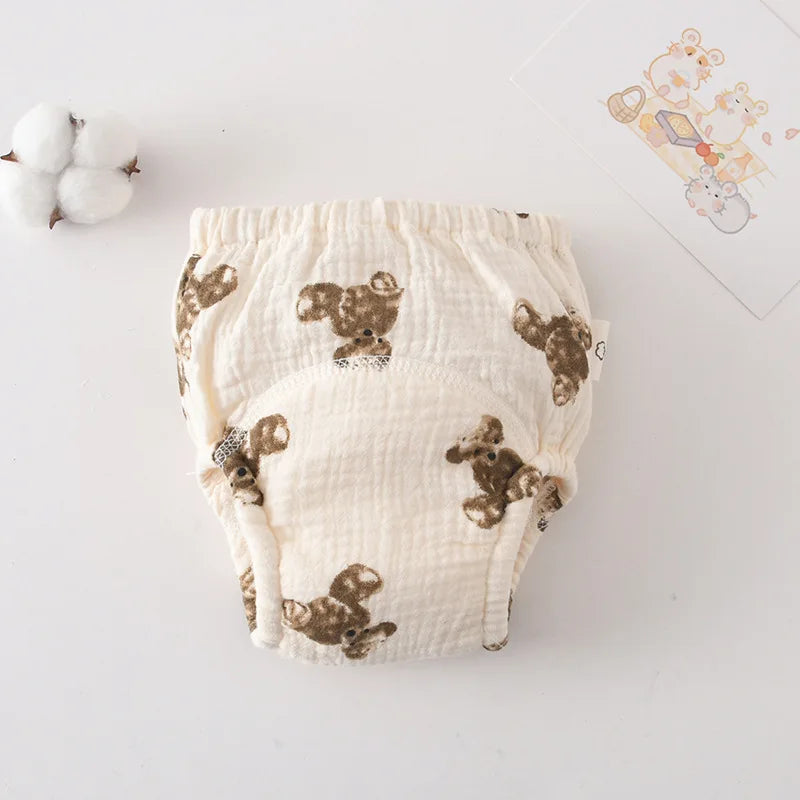 Reusable baby training diaper with cute bear print pattern on soft muslin fabric.