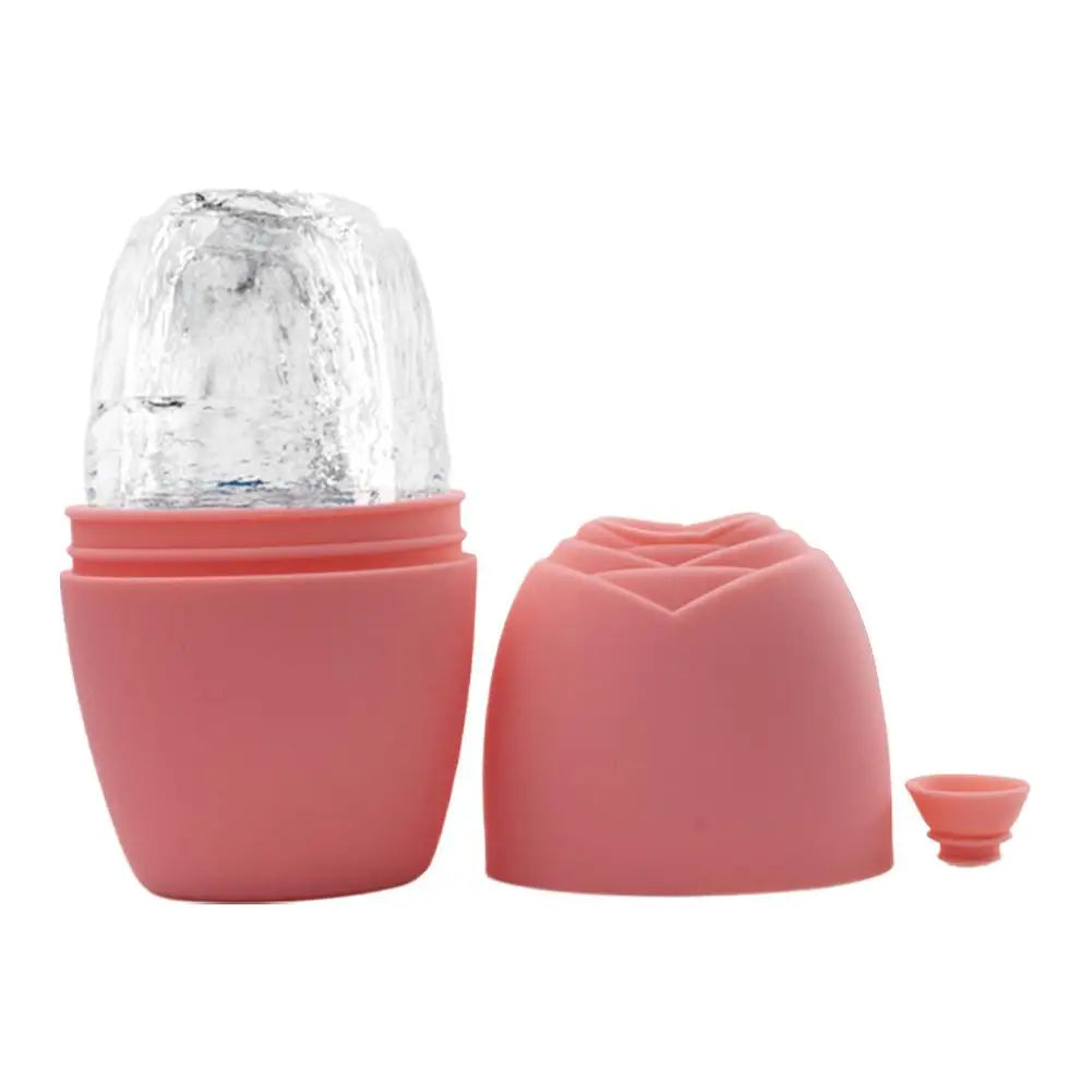 Pink silicone facial ice roller mold with a frozen ice cylinder, a rose-shaped cap, and a small silicone plug.