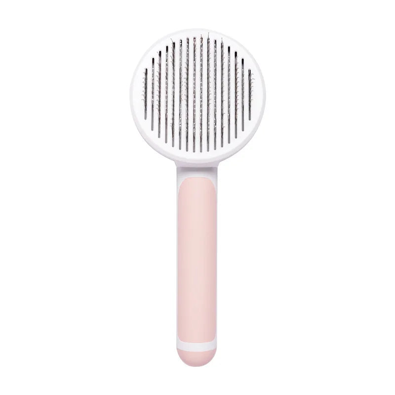 Self-cleaning white and pink slicker brush for cats and dogs to effectively remove loose hair and tangles.