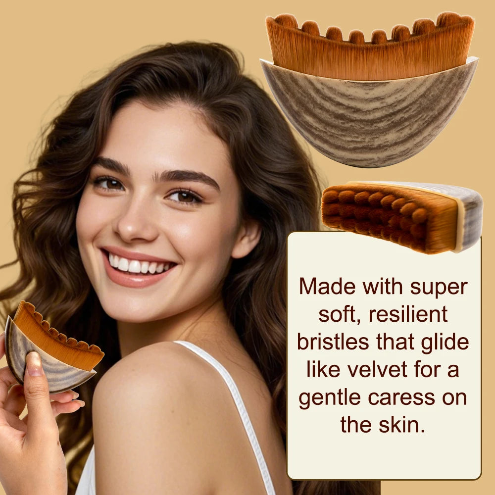 A semi-circular facial massage brush with brown, scalloped bristles and a textured, wood-grain patterned handle.