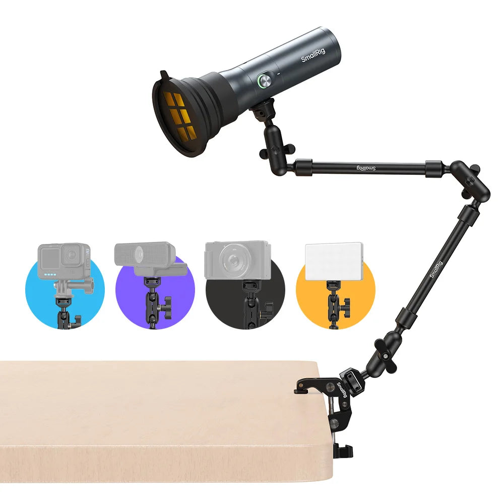 Adjustable desk mount arm with clamp, holding a cylindrical LED light, compatible with cameras and lighting accessories.