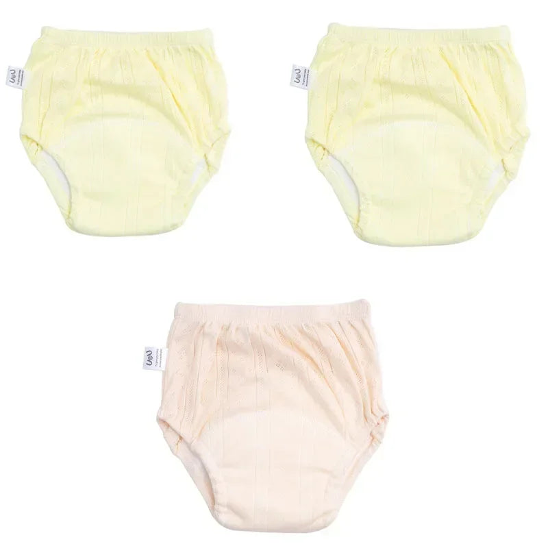 Set of 3 Uou baby training diaper pants in yellow and peach colors, soft cotton baby care underwear.