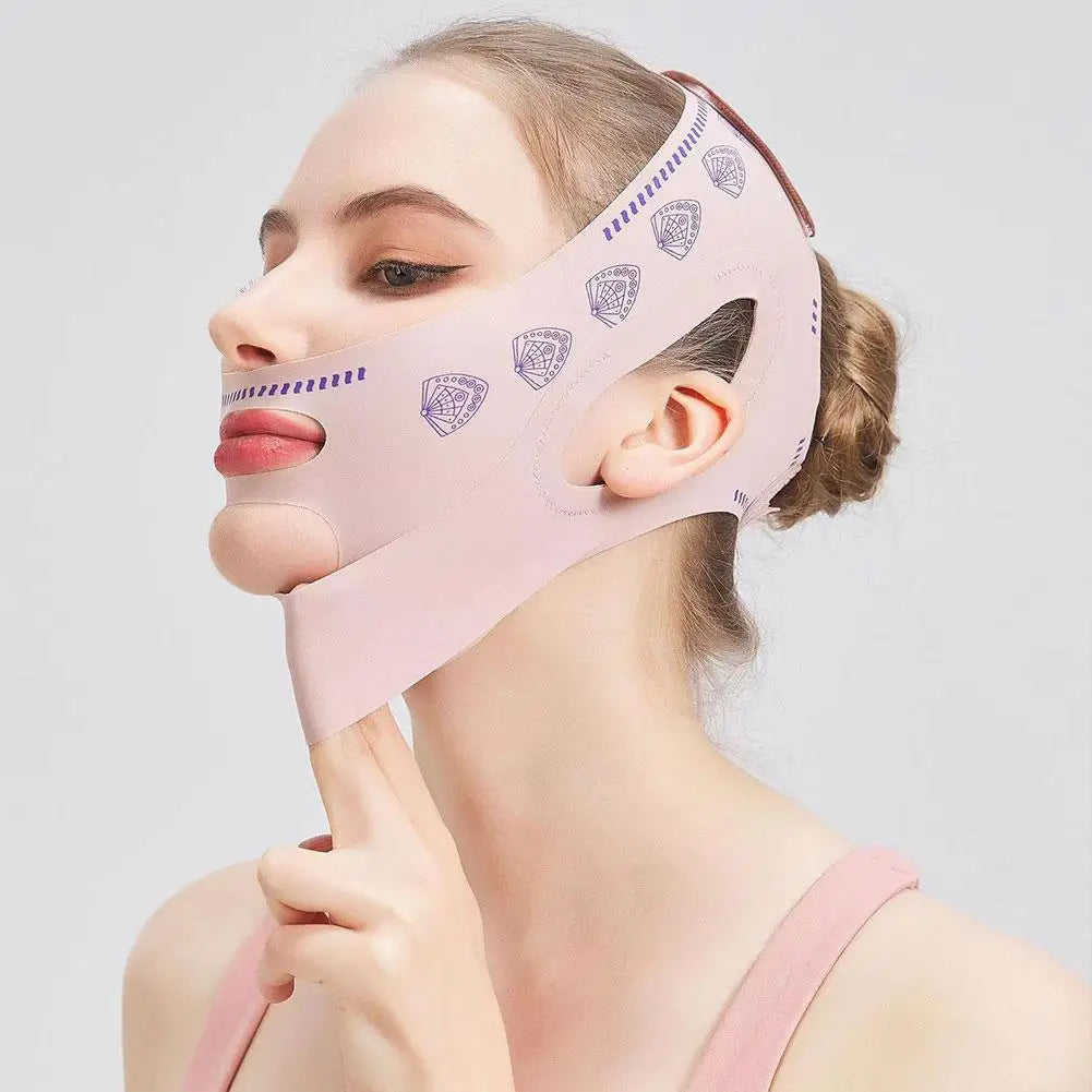 A light pink V-line face slimming strap worn by a woman, featuring purple fan patterns and ear cut-outs.