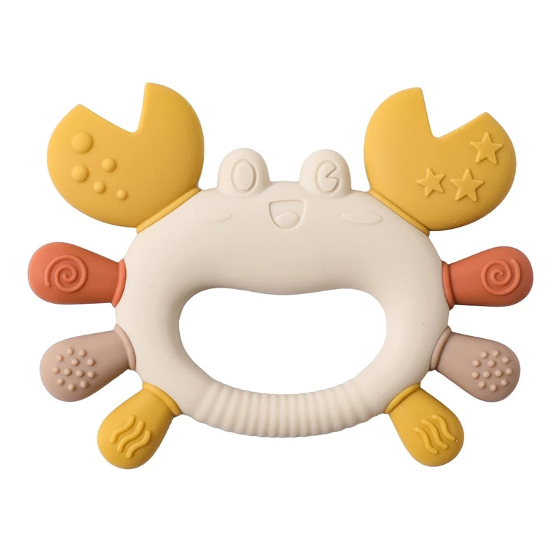 Yellow, beige, and orange silicone crab baby teething toy for soothing sore gums.